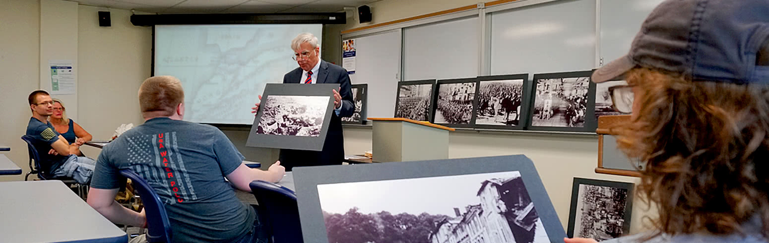 Harper History Department professor presenting a lesson to History Associate Degree students in a classroom on Harper College's campus in Palatine, Illinois.