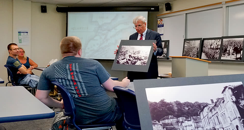 Harper History Department professor presenting a lesson to History Associate Degree students in a classroom on Harper College's campus in Palatine, Illinois.