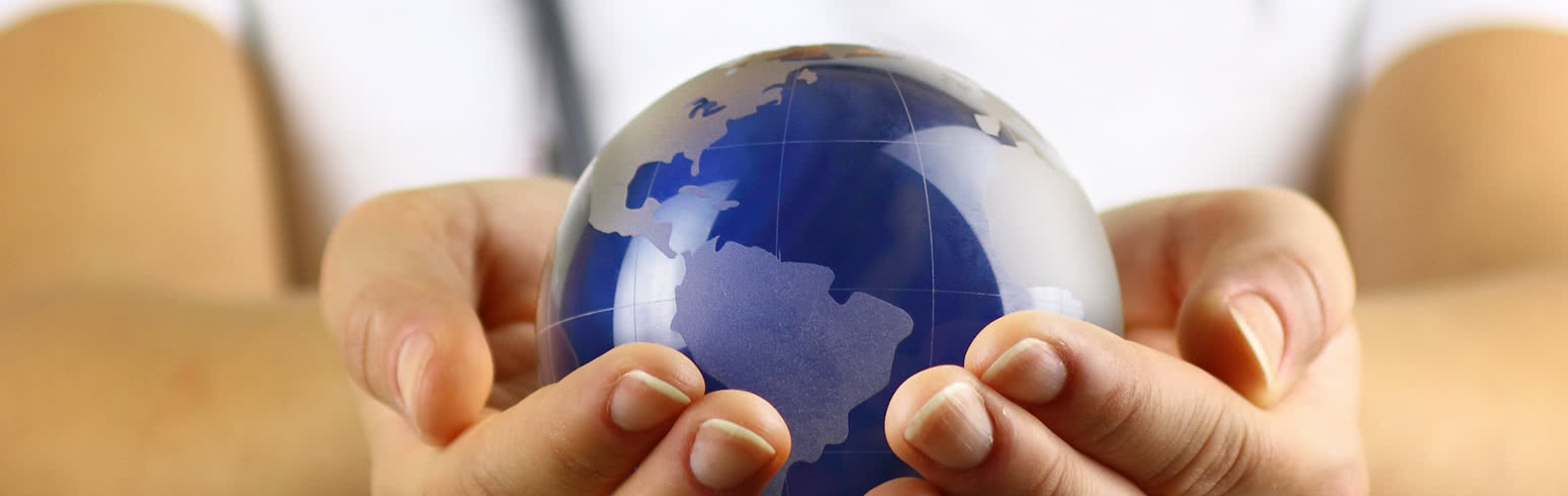 Hands holding a globe