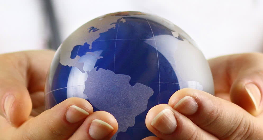 Hands holding a globe