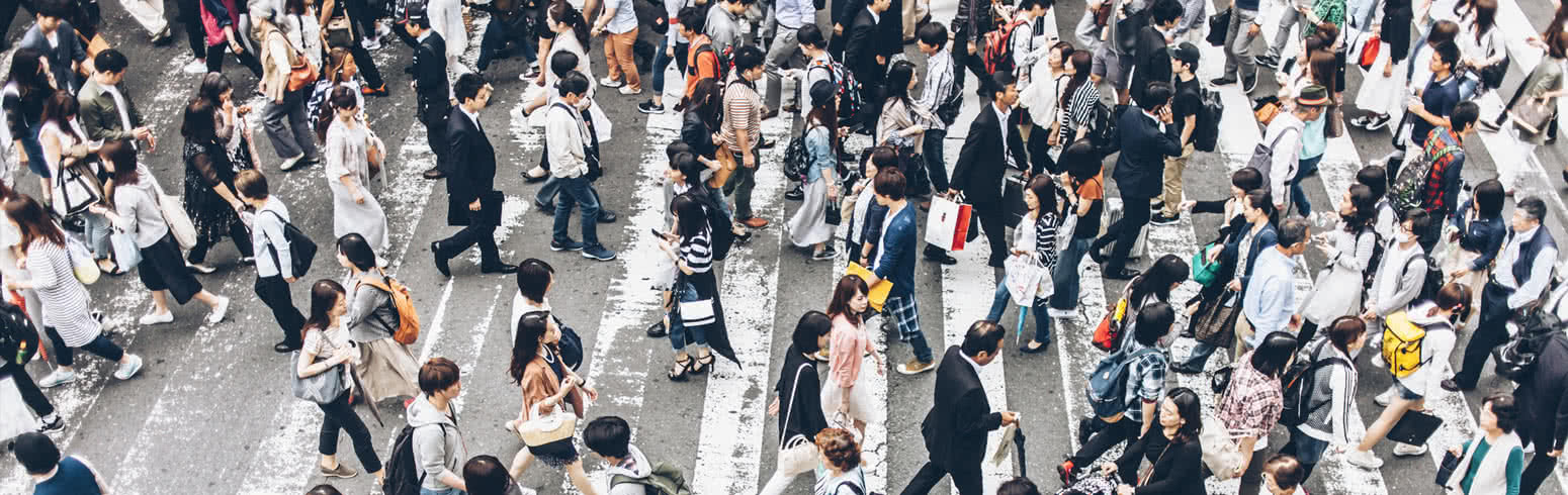 Crowd of people crossing the streets