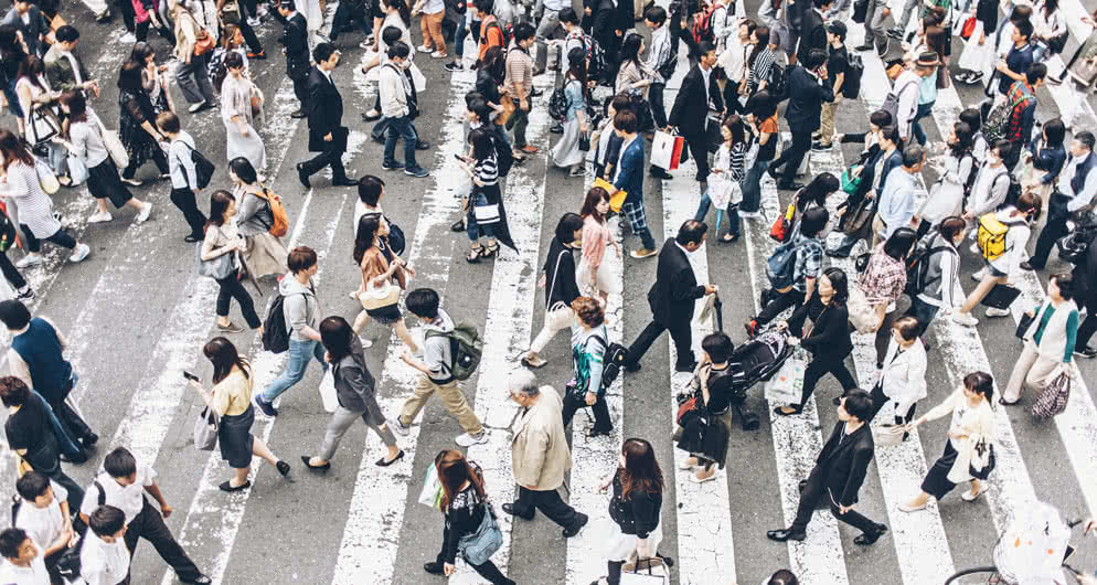 Crowd of people crossing the streets