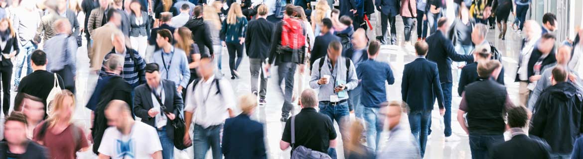 A busy street filled with people walking