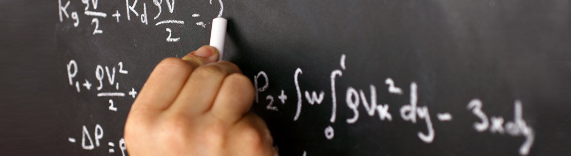 Math equations being written on chalkboard by a person's hand