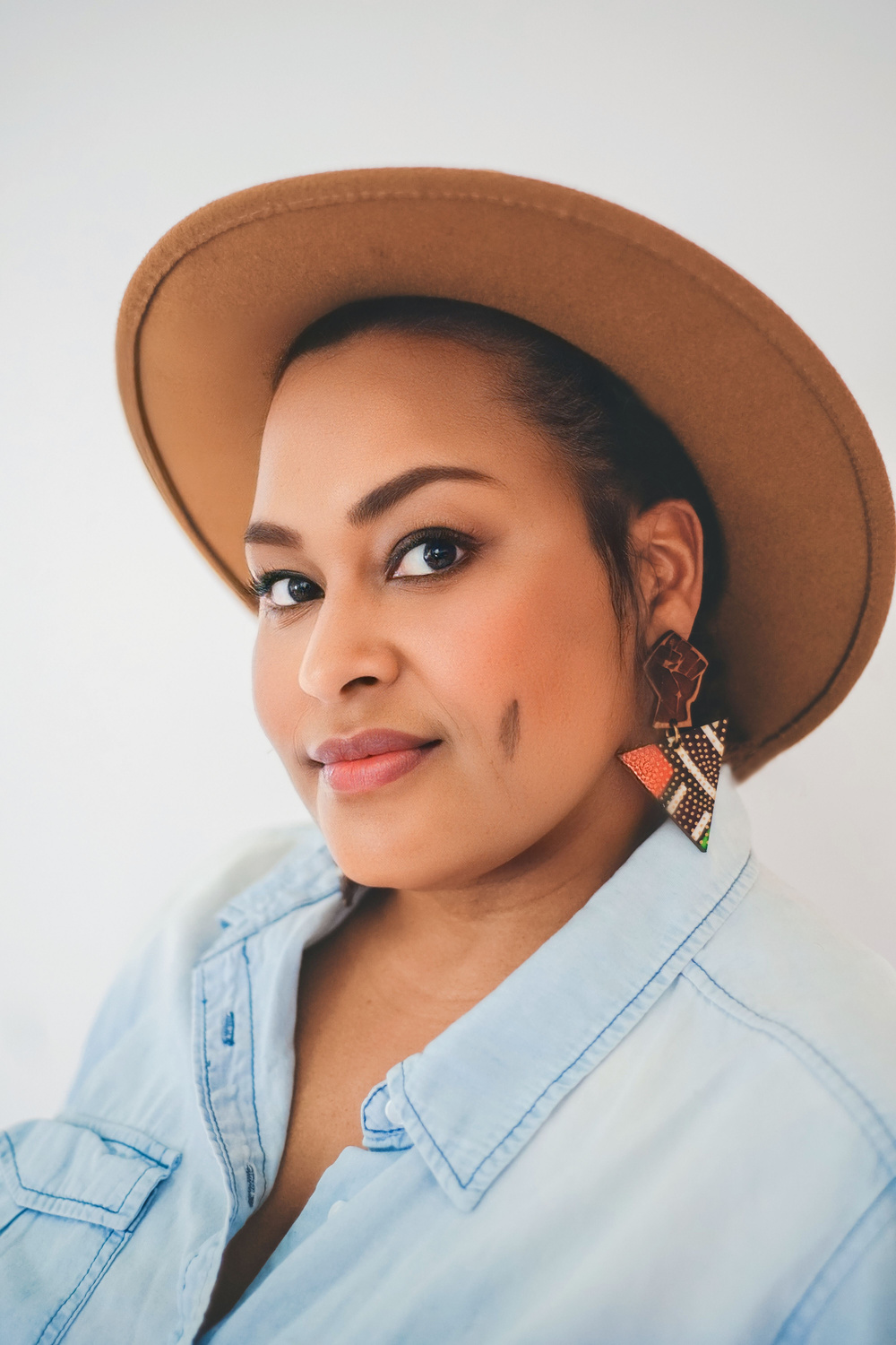 Jen White-Johnson, in a sassy cowboy hat at an angle.
