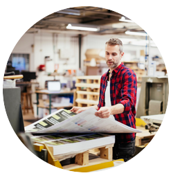 Man with large-format printouts