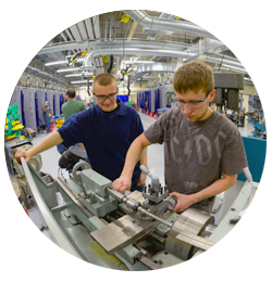 Students use manufacturing equipment