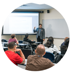Insructor gives presentation in classroom