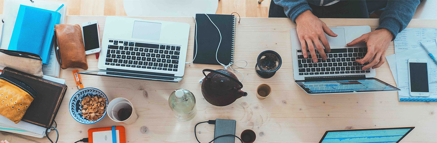 Laptops and mobile devices on a table