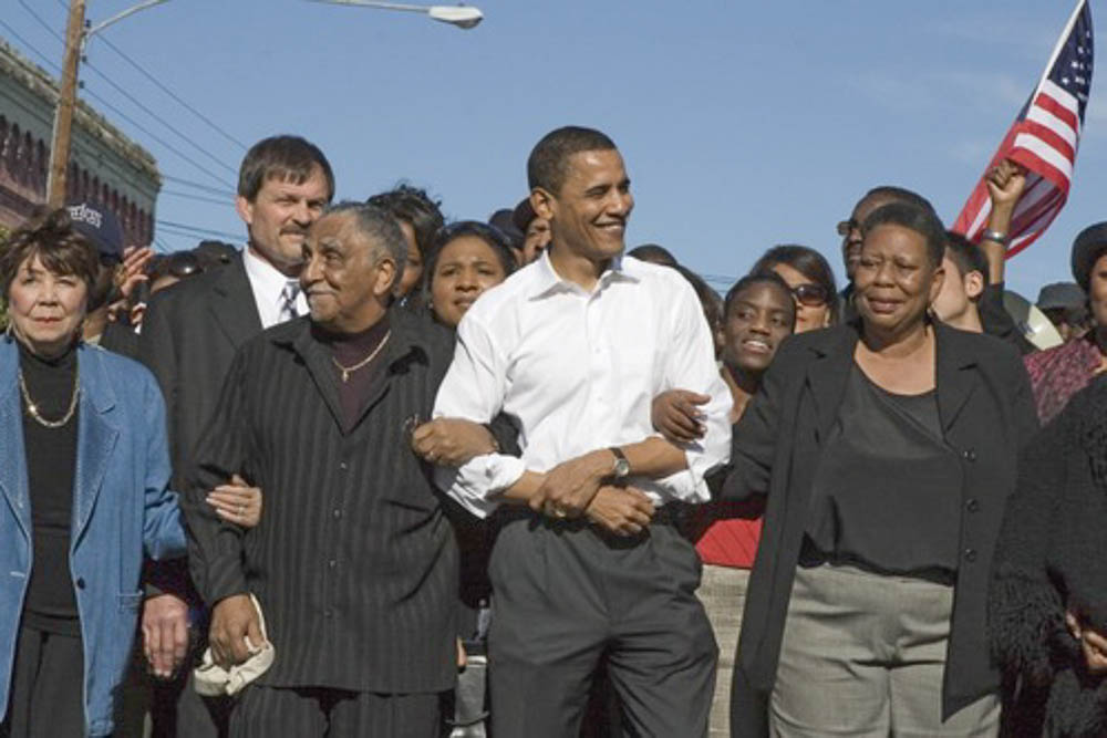 Joann Bland stands next to President Obama smiling