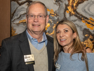 Two guests stand together