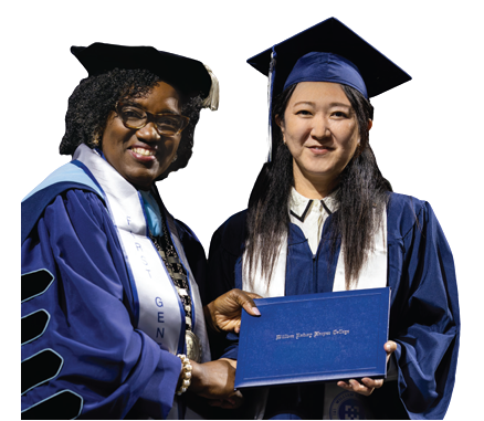 Dr. Avis Proctor, Harper's President, in full graduation regalia presents an Adult Educational Development student a diploma at Harper's graduation.