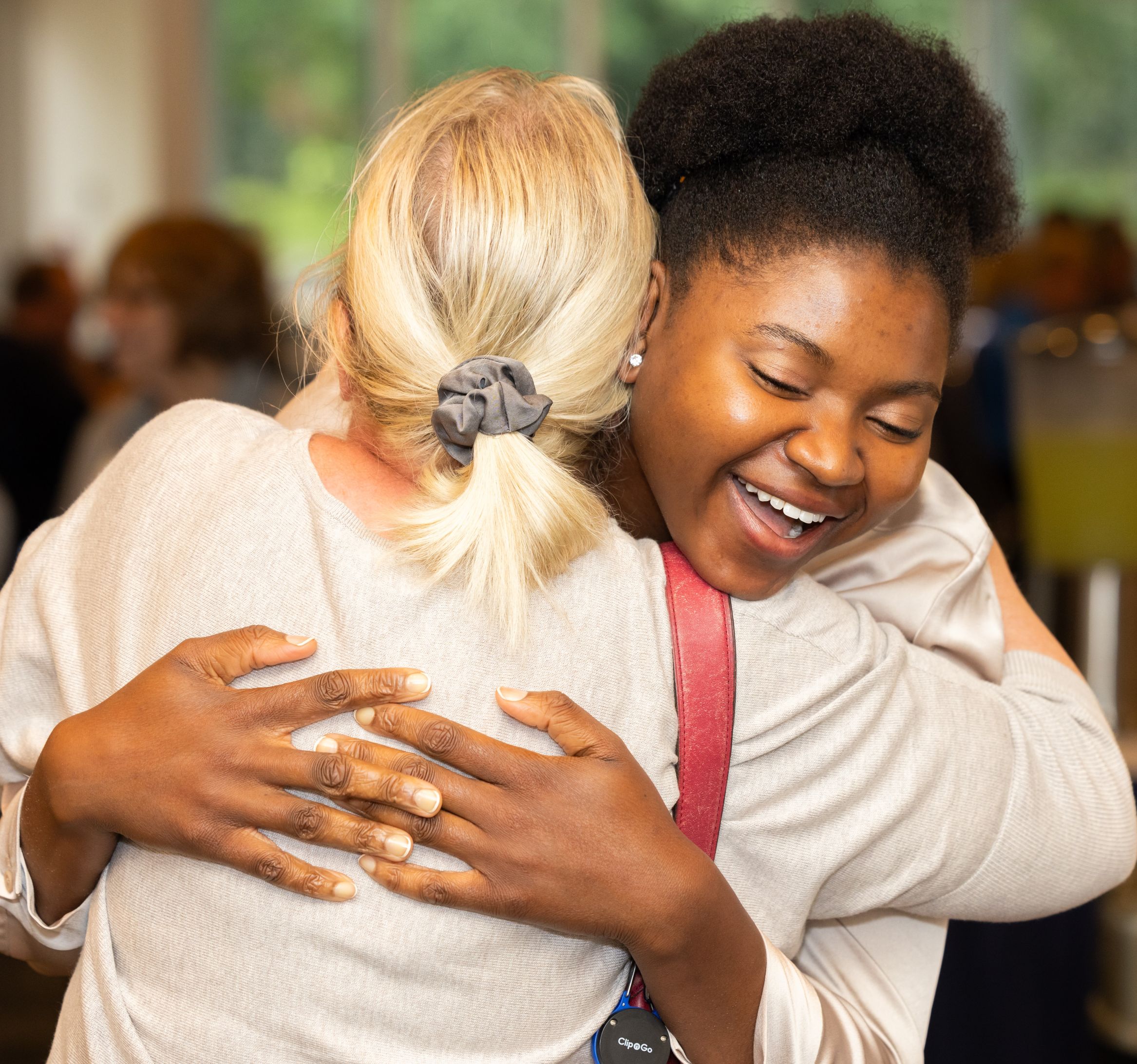 Scholarship recipient hugging a HOPE member