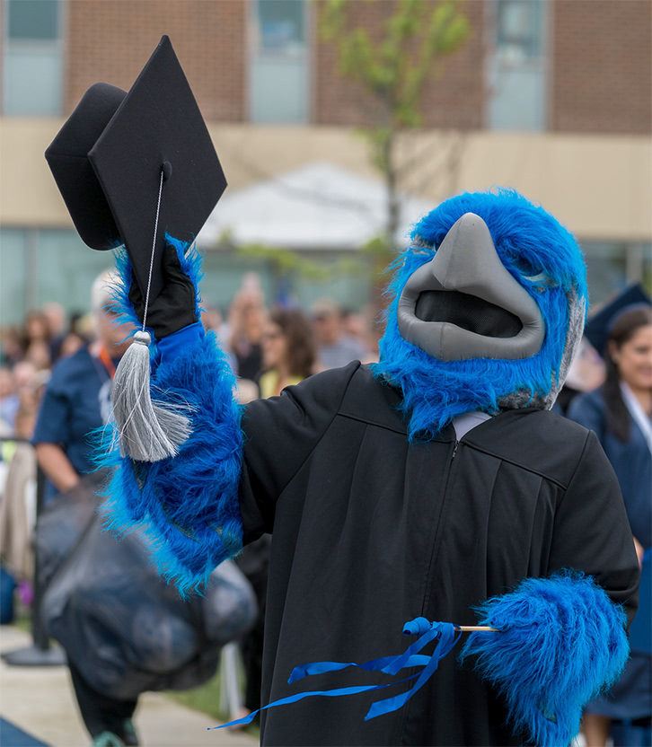 Photo of Harper Hawk holding cap