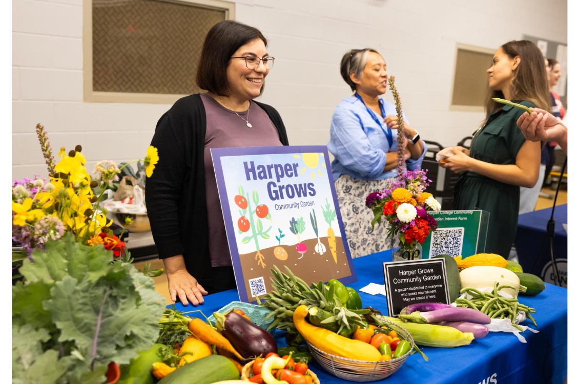 Harper Grows coordinator, Ginger McHugh-Kurtz, promoting the program at the Marketplace.