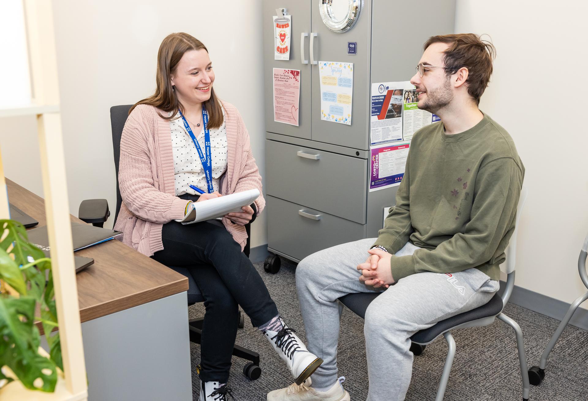 a student speaking with a counselor