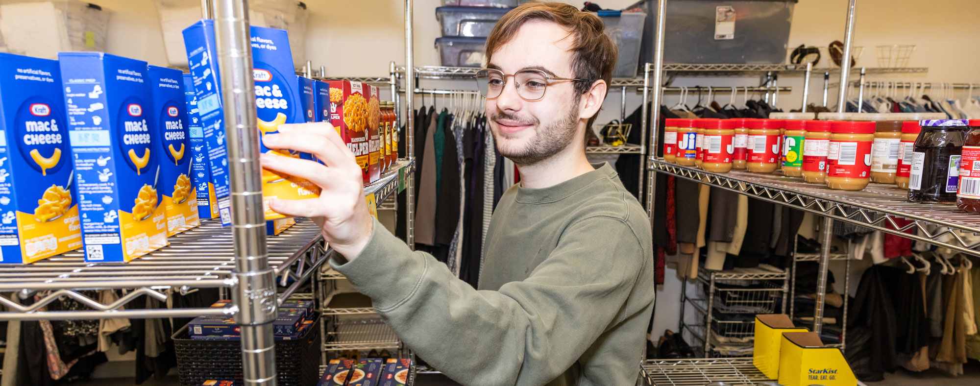 a student browsing shelves in the food pantry