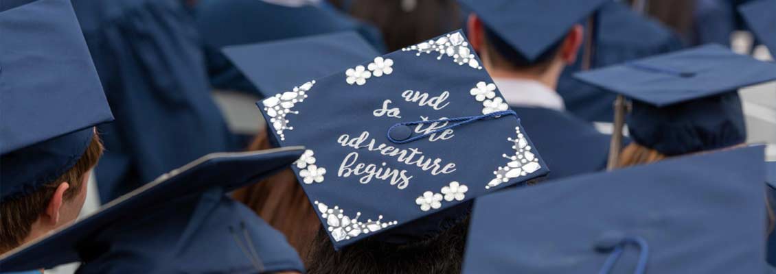 Graduation cap that reads: So the adventure begins...