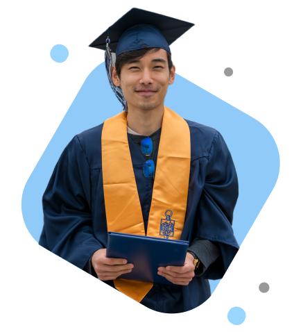 Male student in cap and gown with diploma