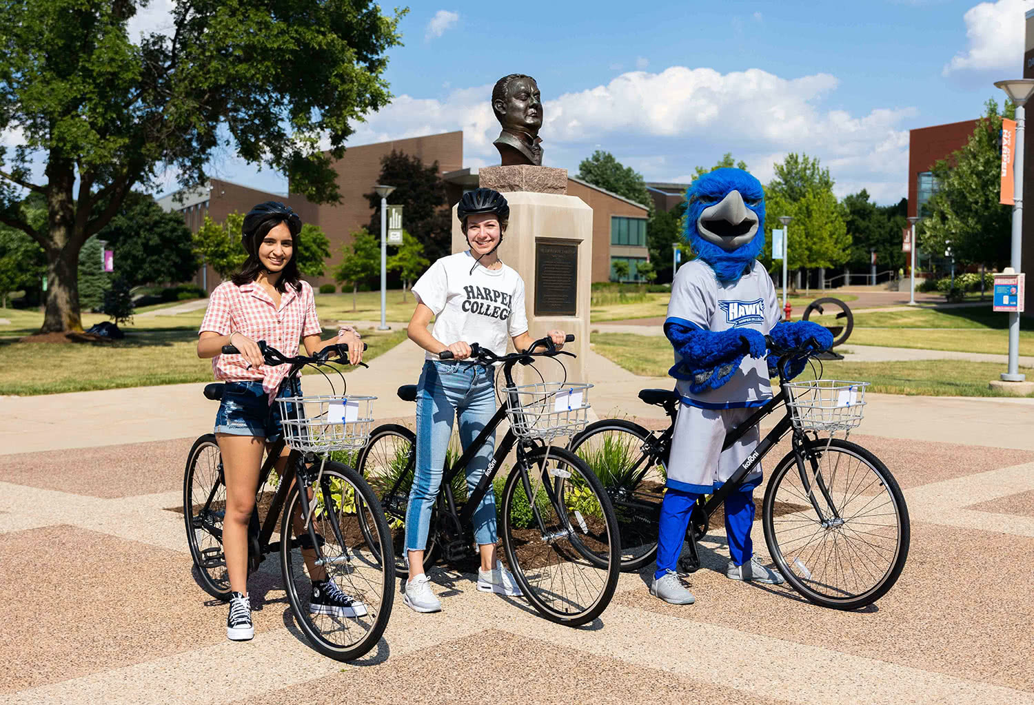 Harper Hawk and two women riding bikes together