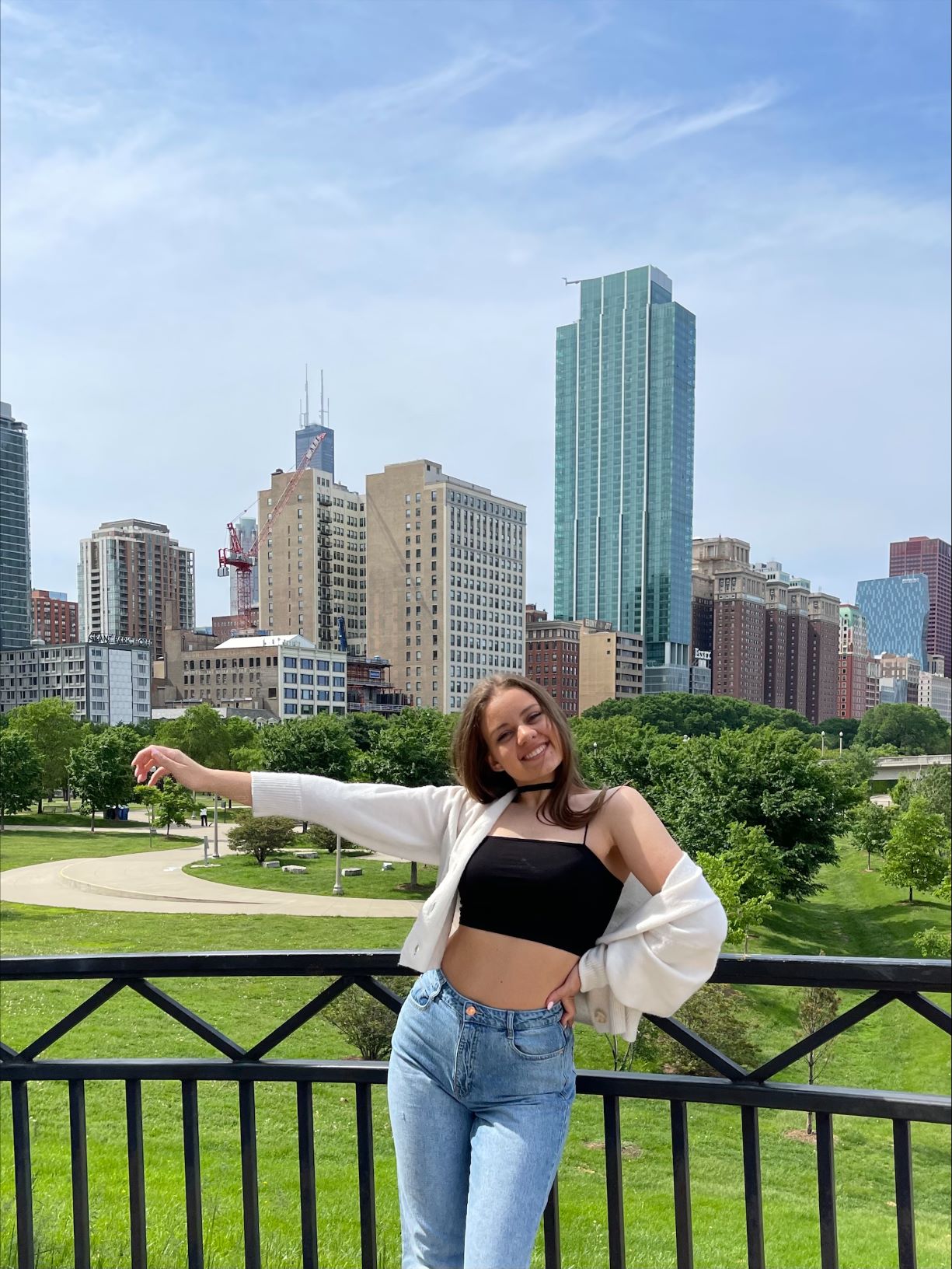 Photo of woman in front of Chicago skyscrapers posing.