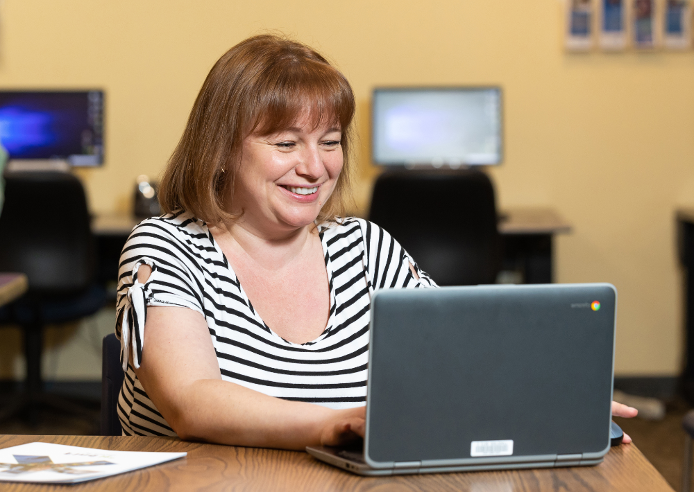 Student in an AED program uses a laptop borrowed from the Harper College library in Palatine, Illinois.