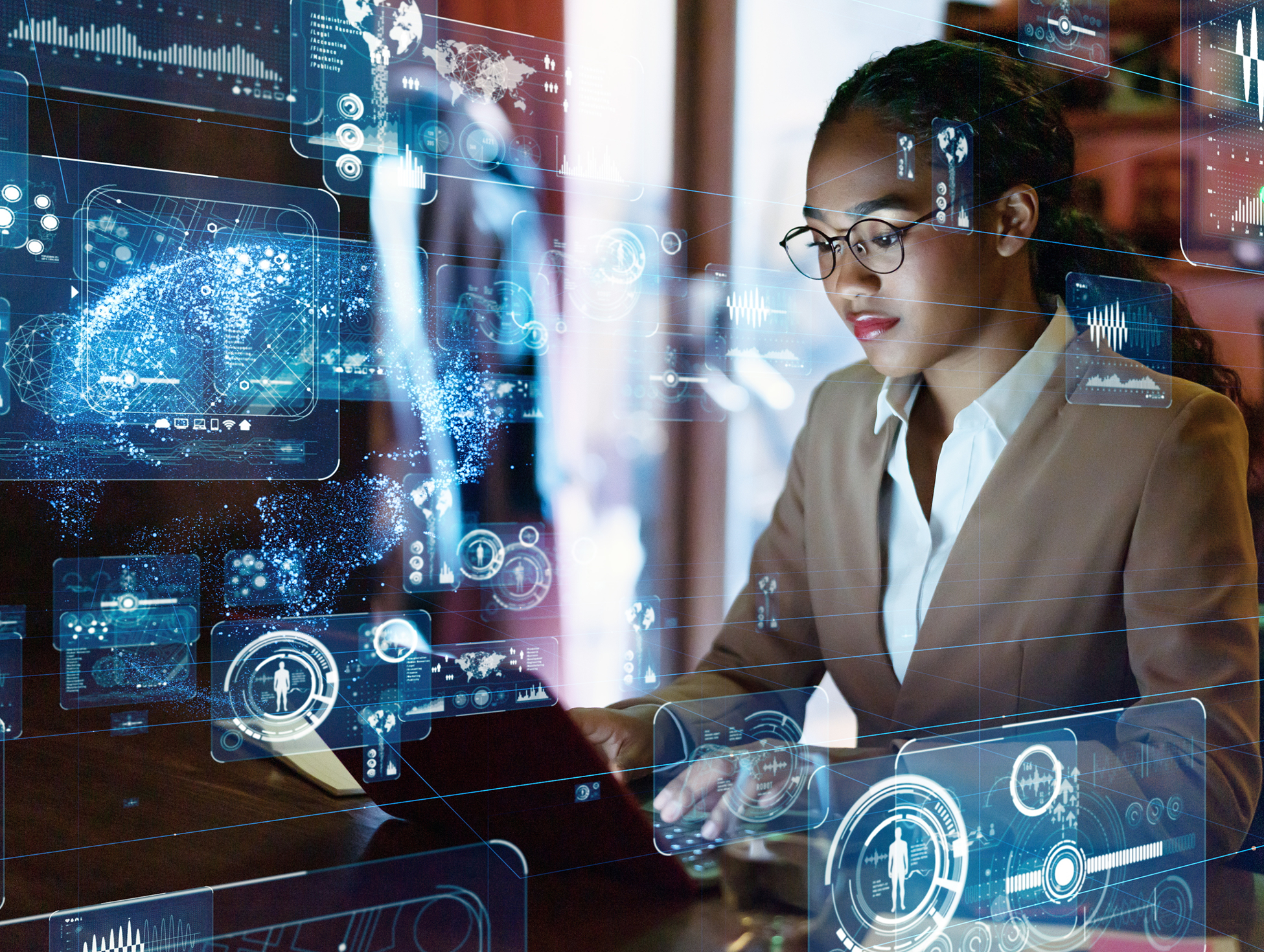 A woman wearing glasses works on a laptop surrounded by futuristic digital interface graphics and data visualizations.