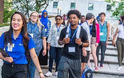 A Harper College staffer leads a tour of high school students and parents