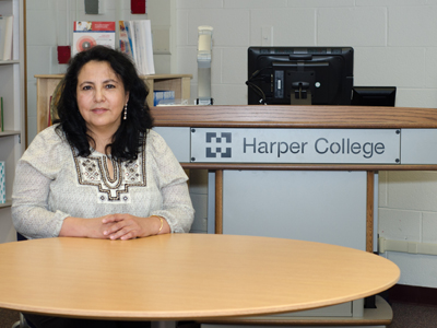 Maria, an LCC students sits in the library