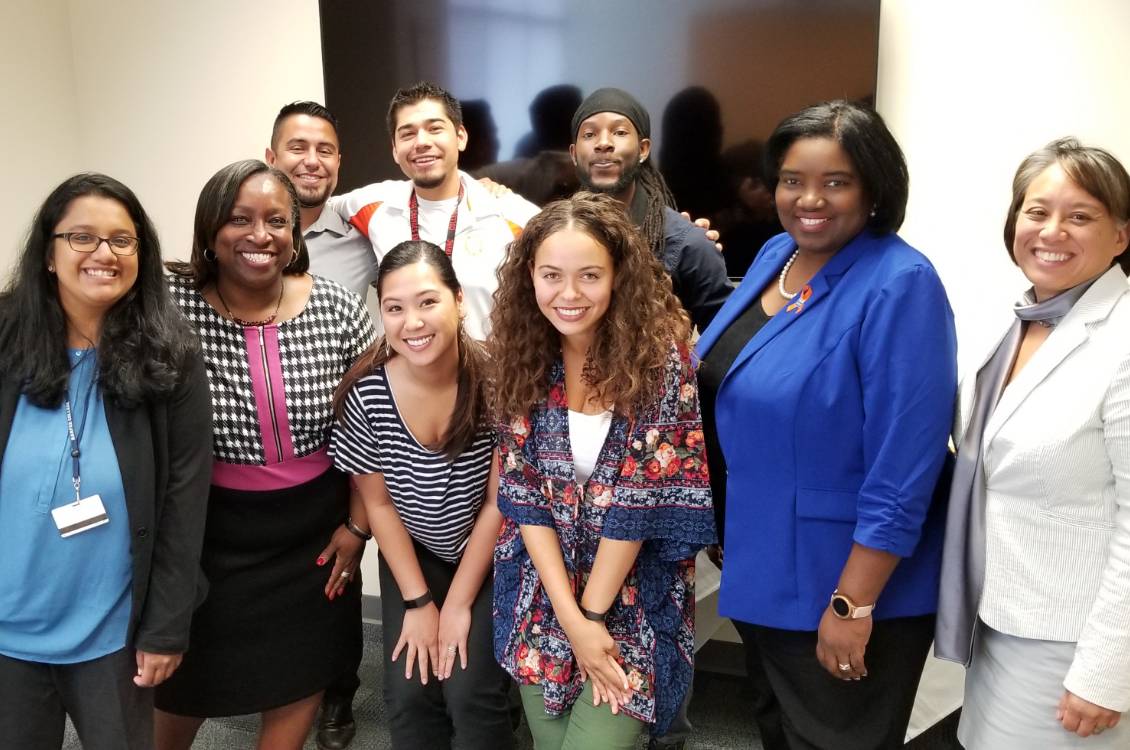 Dr. Proctor standing with group of people