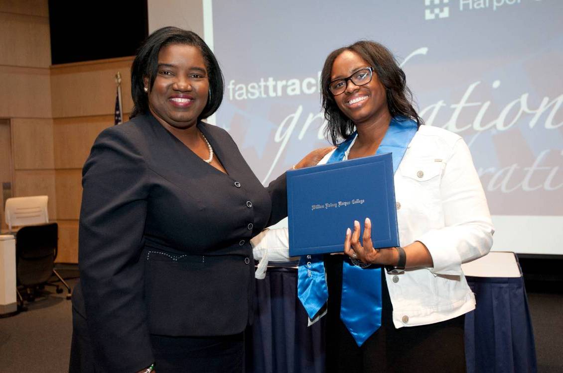 Dr. Proctor with a Fast Track Student holding diploma