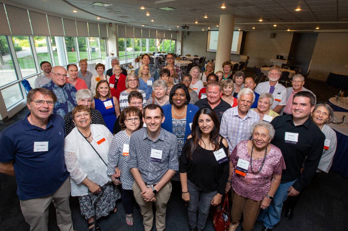 Dr. Proctor with large group of Harper Alumni