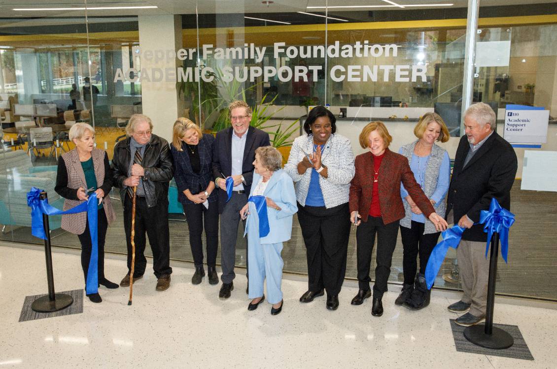 Dr. Proctor cuts the ribbon at the Pepper Family Foundation Academic Support Center.