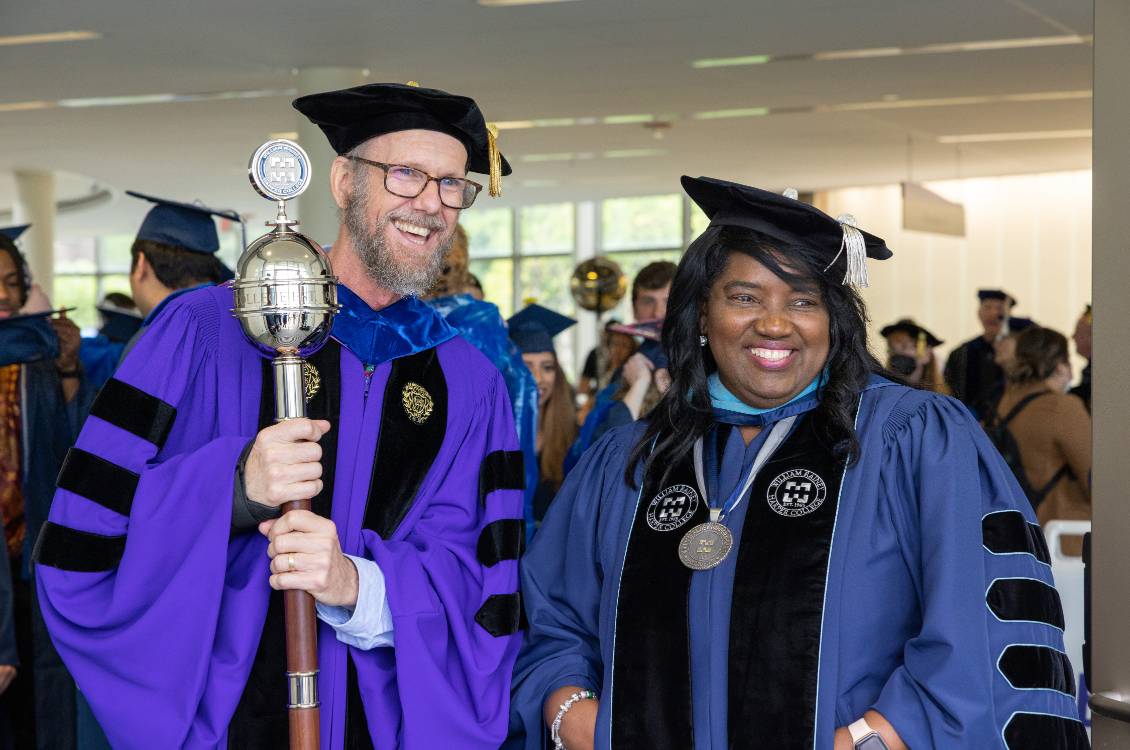 Dr. Proctor with a faculty member at graduation reception.