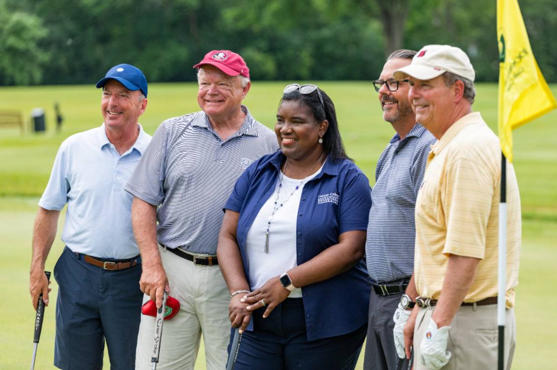 Dr. Proctor with a group of golfers at a Harper Educational Foundation golf outing.