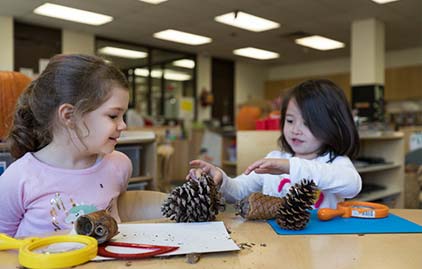 Students play and learn in classroom.