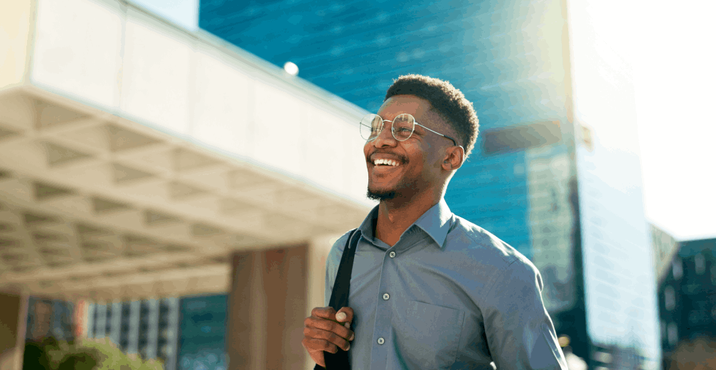 Man walking outside with a smile.