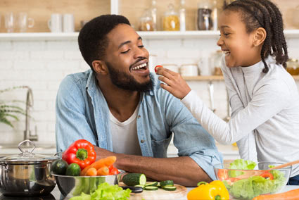 Family cooking in kitchen