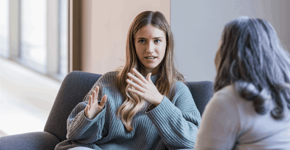 Young woman talking through a big decision with her mother.