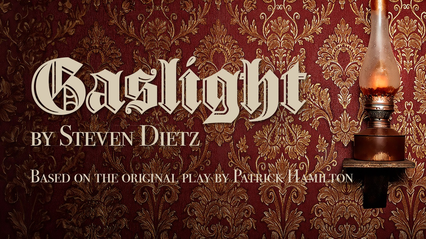 A gaslight sconce on orantely wallpapered wall