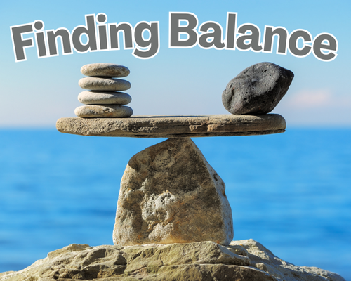 Photo of balanced flat rocks on waterfront
