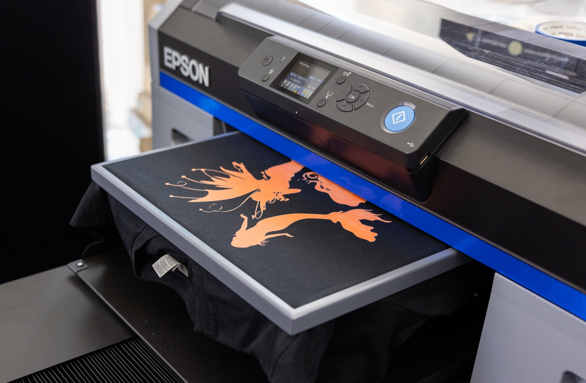 Graphic being printed onto a black t-shirt 