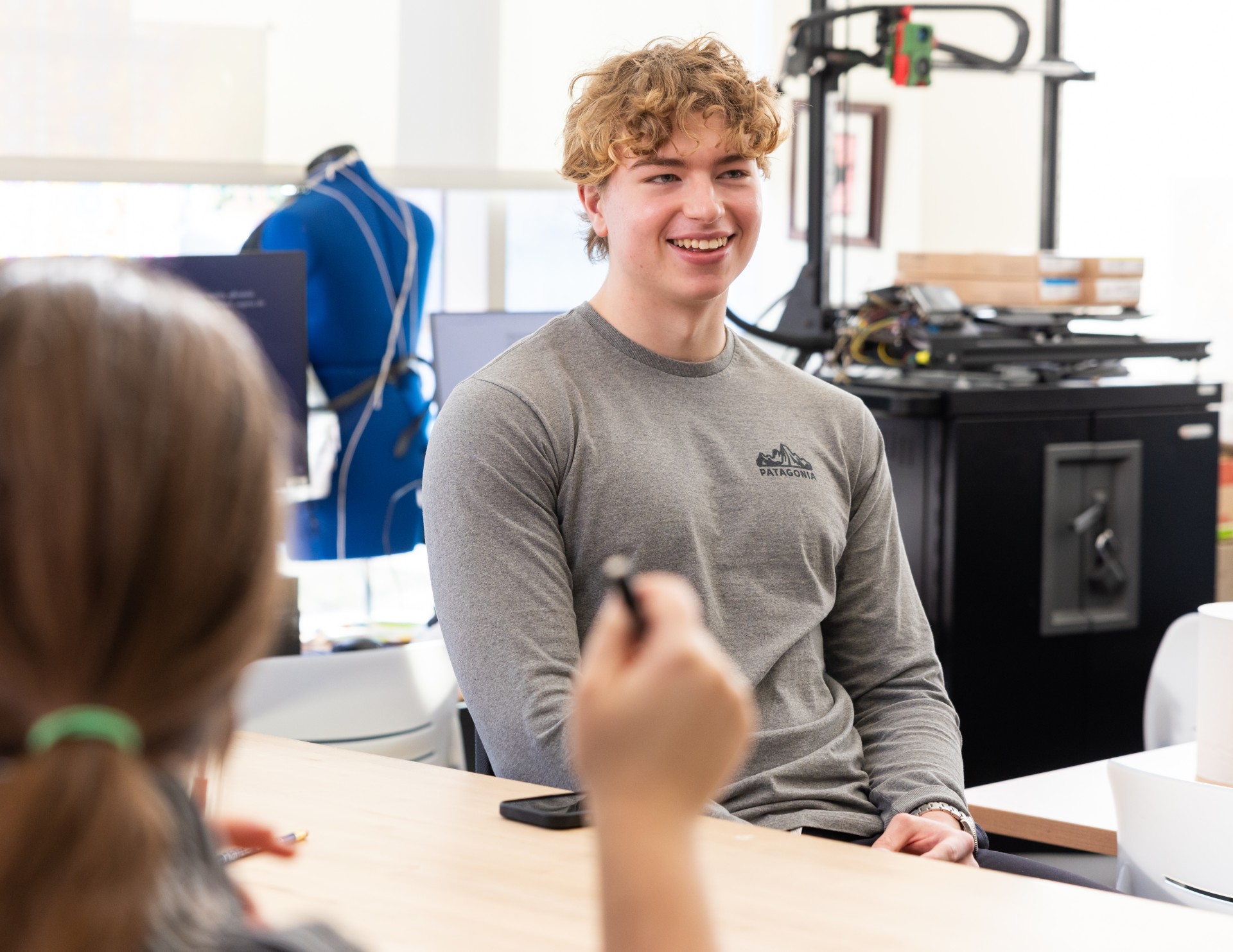 Student smiling during club meeting