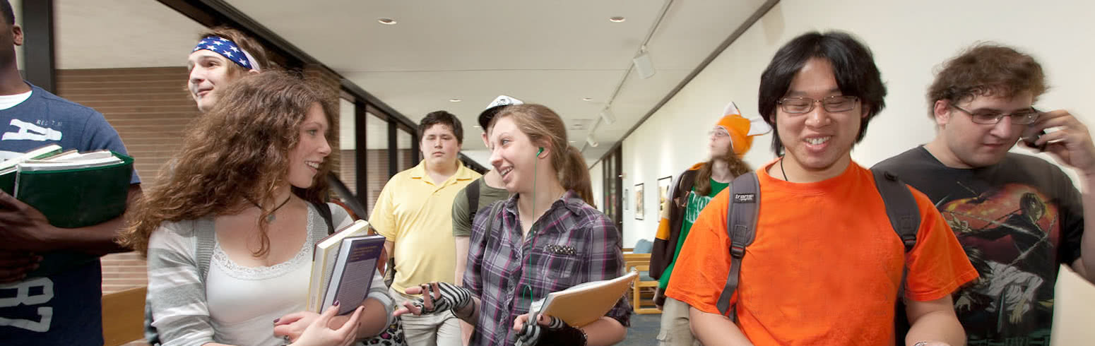 Students walk together after class, talking and smiling
