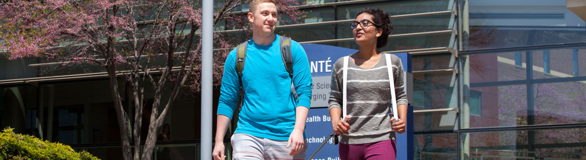 male and female students walking together away from Avante building