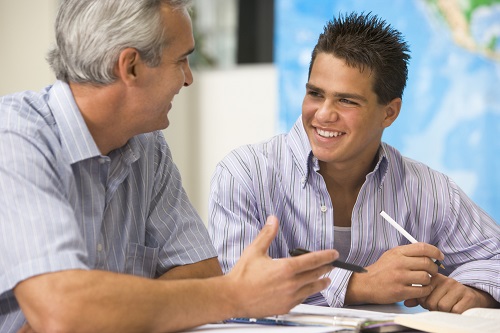 man helping a student