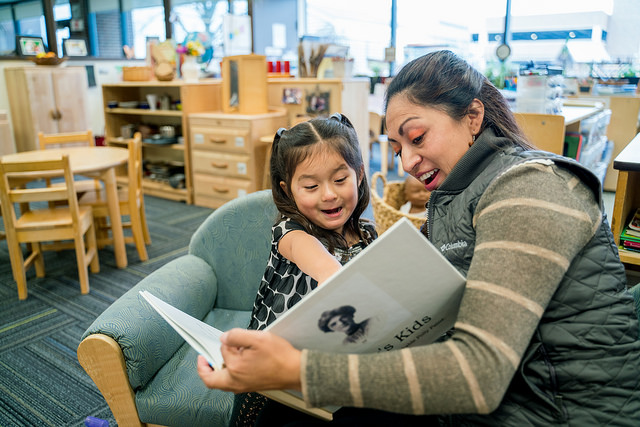 Ana reading with her daugher