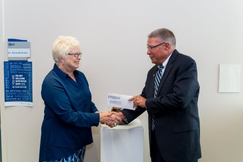 Mary Jane Kirkwood receives award from Dr. Ender