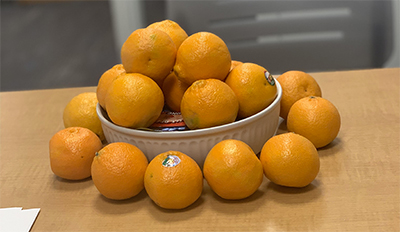 Photo of organes in a bowl. 