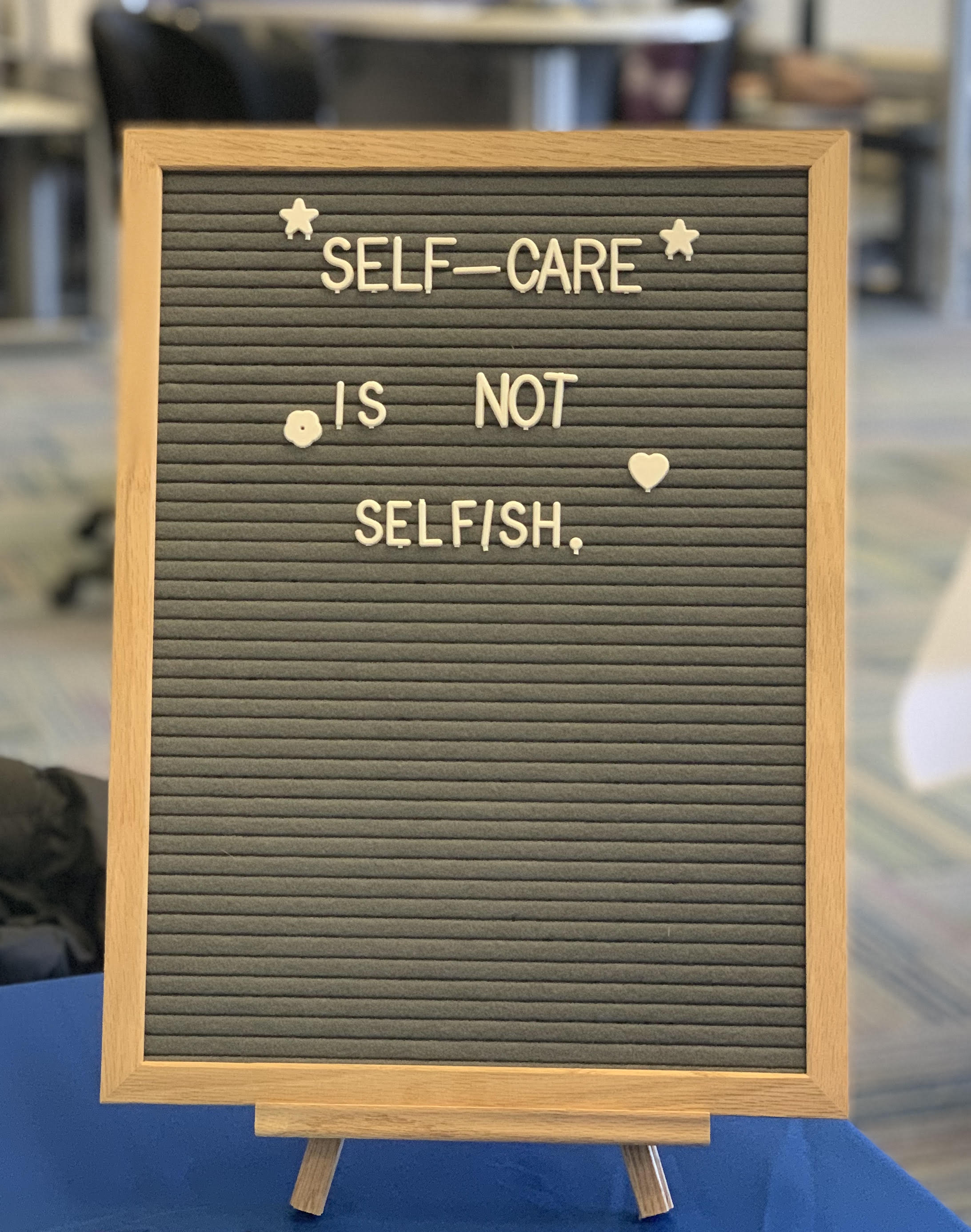 Photo of a letterboard that says, "Self Care is Not Selfish." 